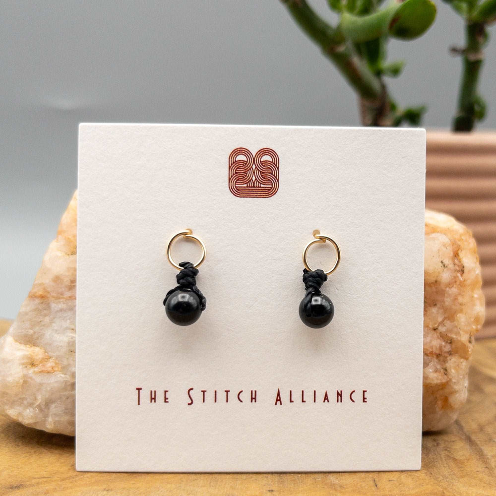 black spinel earrings 14k gold fill on a white card
