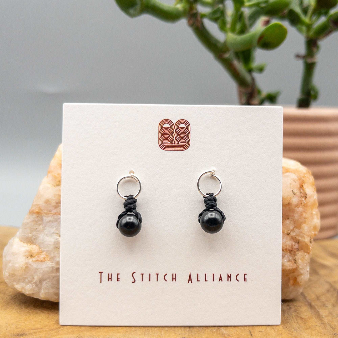 black spinel sterling silver earrings on a white background