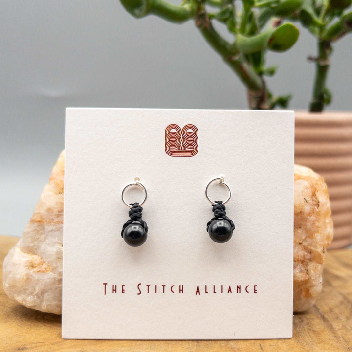 black spinel sterling silver earrings on a white background