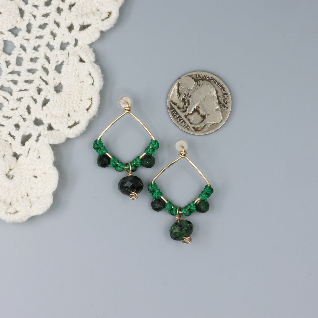 Handmade macrame earrings with gold fill and ruby zoisite beads with a nickel for size comparison