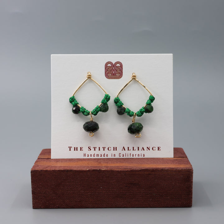 Handmade macrame earrings with gold fill and ruby zoisite beads on a white card