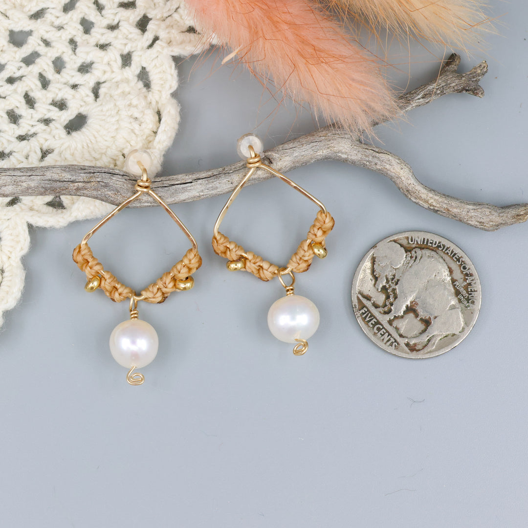 handmade square shaped gold macrame earrings with freshwater pearl beads with a nickel for size comparison