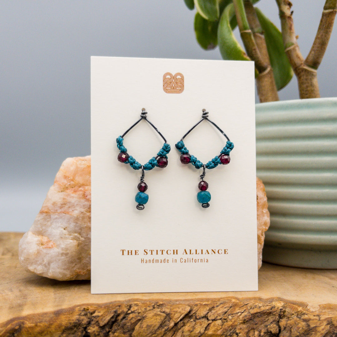 handmade oxidized sterling silver garnet macrame earrings on a white card