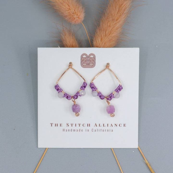 handmade rose gold, lepidolite, moonstone earrings. shown on a white card