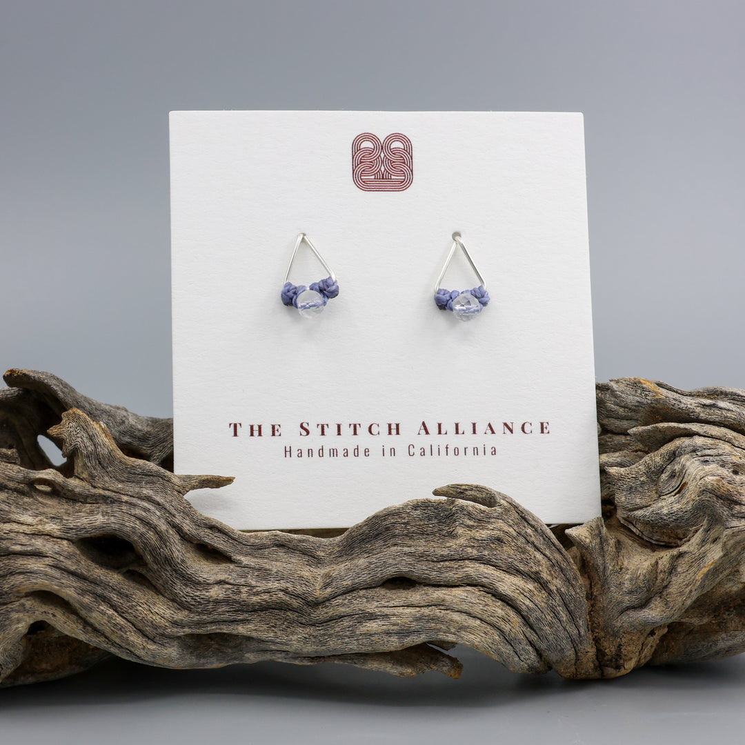 clear quartz stud earrings sterling silver triangle on a white card