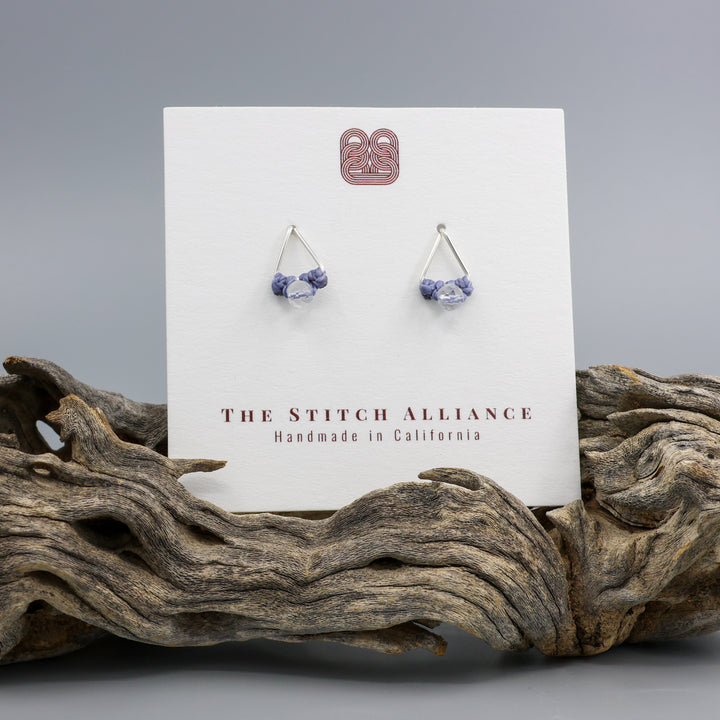clear quartz stud earrings sterling silver triangle on a white card