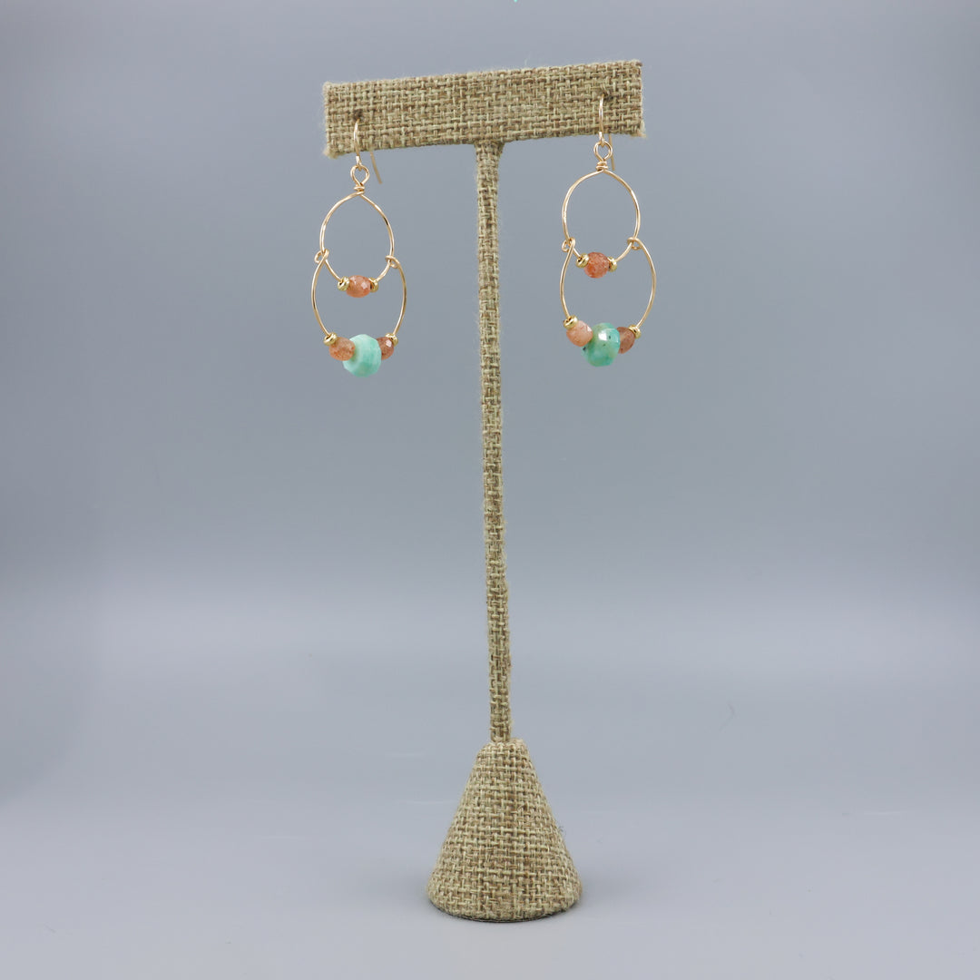 handmade gold fill double hoop earrings with amazonite and sunstone beads on a linen hanger