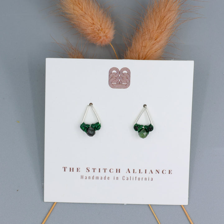 handmade Emerald stud earrings sterling silver triangle on a white card