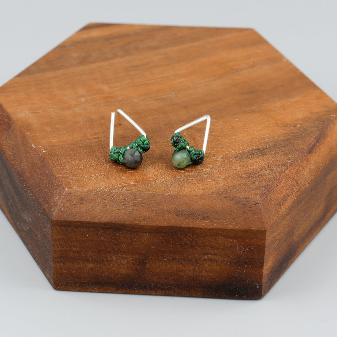 Emerald stud earrings sterling silver triangle on wood