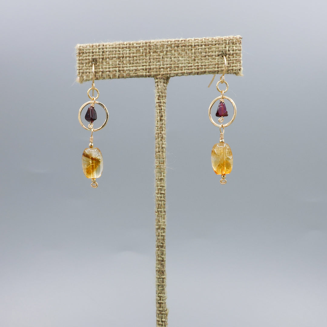 handmade citrine, garnet, and 14k gold filled earrings on a linen hanger