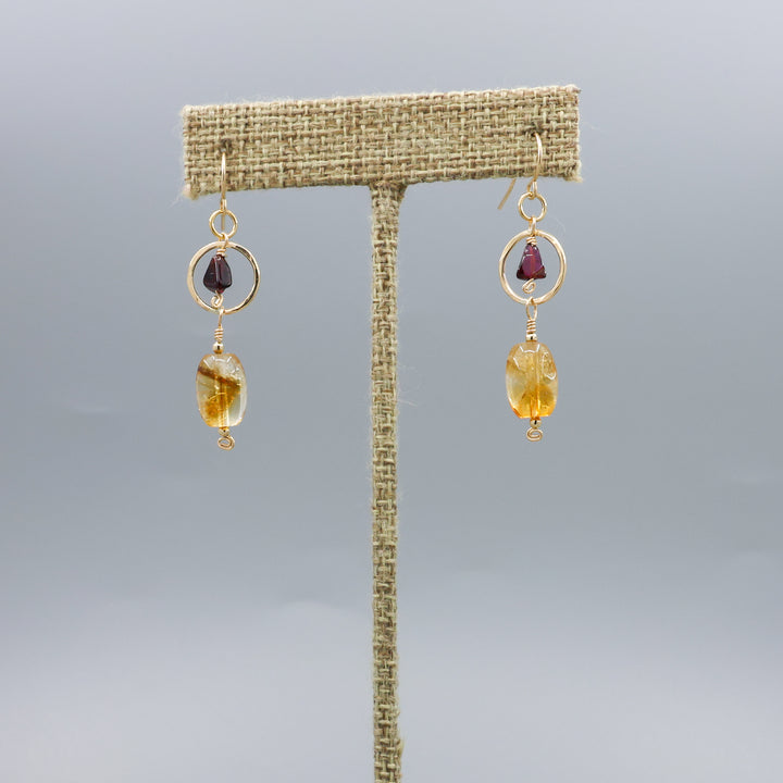 handmade citrine, garnet, and 14k gold filled earrings on a linen hanger