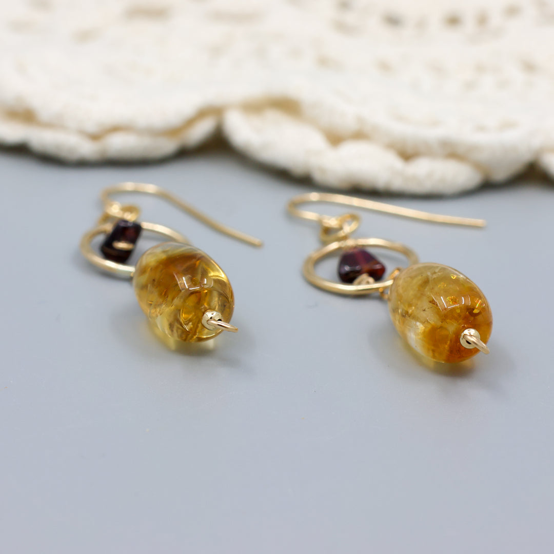 handmade citrine, garnet, and 14k gold filled earrings close up view
