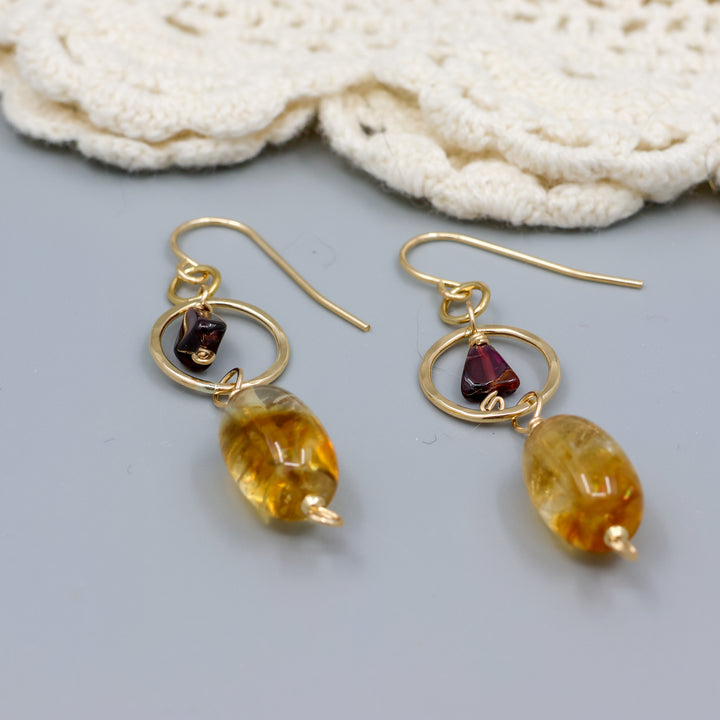 handmade citrine, garnet, and 14k gold filled earrings close up view