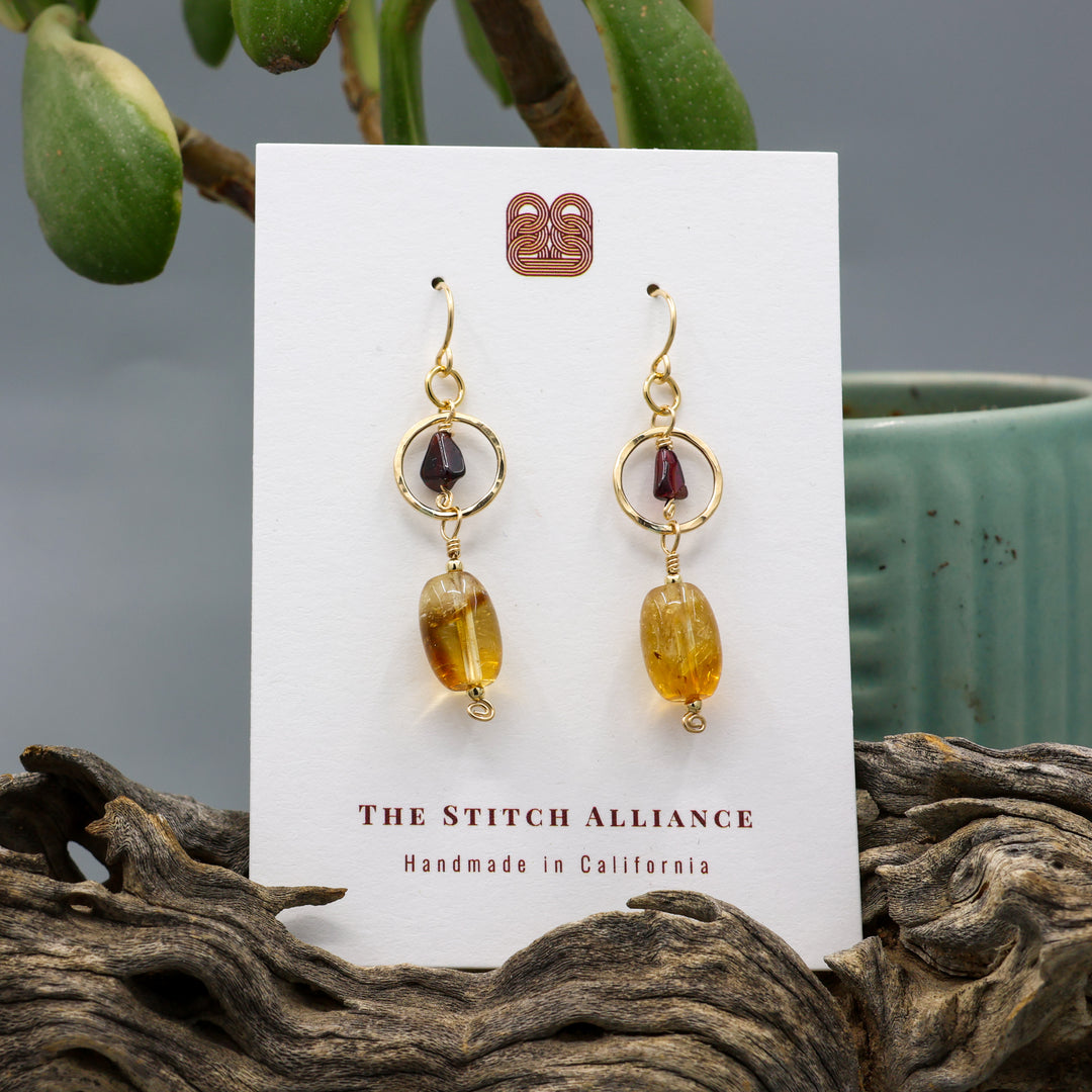 handmade citrine, garnet, and 14k gold filled earrings shown on a white card