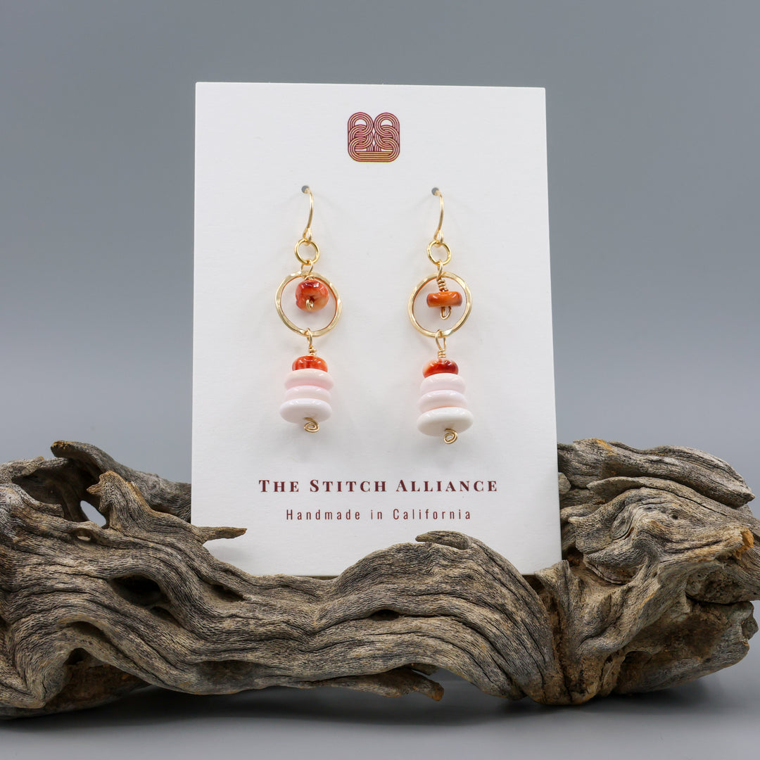 queen conch and spiny oyster gold fill earrings on a white card