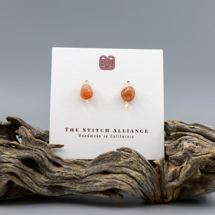 handmade sunstone gold fill stud earrings on a white card