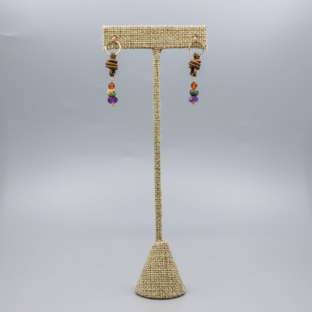 handmade amethyst, green garnet, and hessonite leather and gold fill earrings full view
