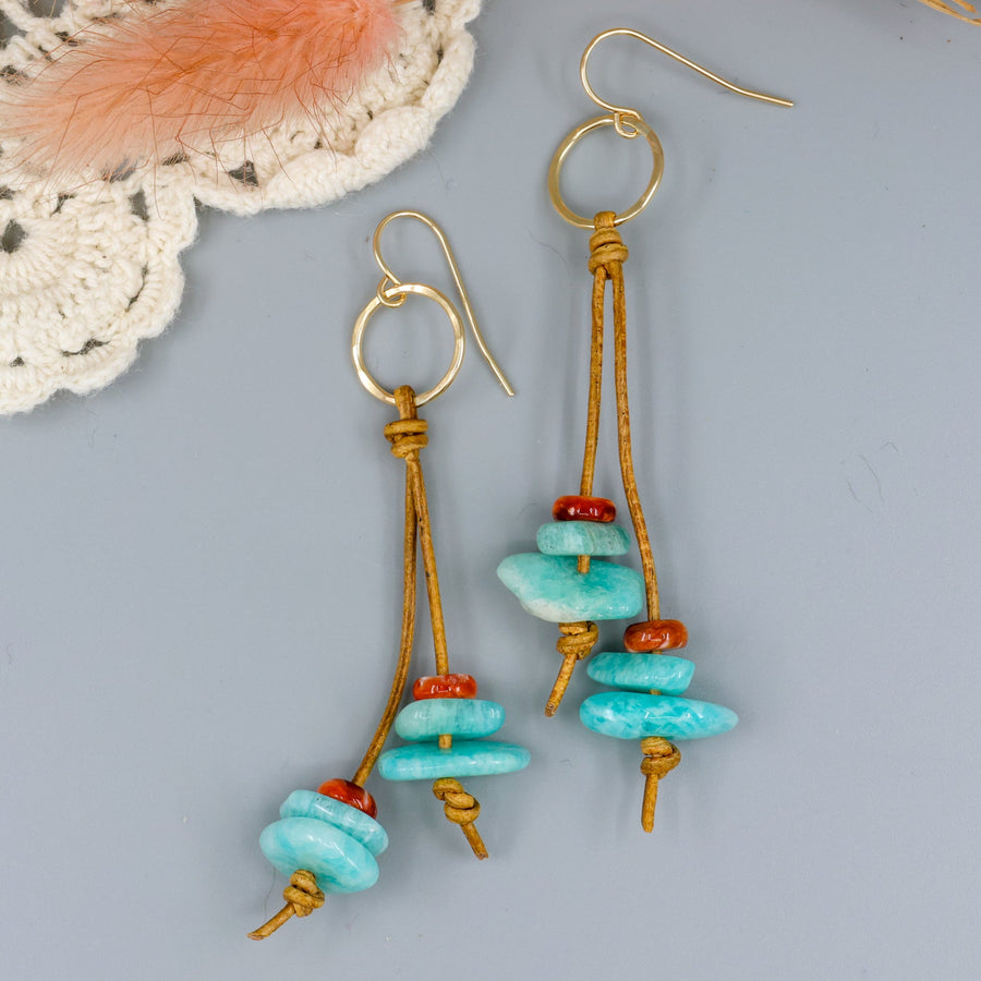 handmade gold fill and leather fringe earrings with amazonite and spiny oyster beads on a gray background