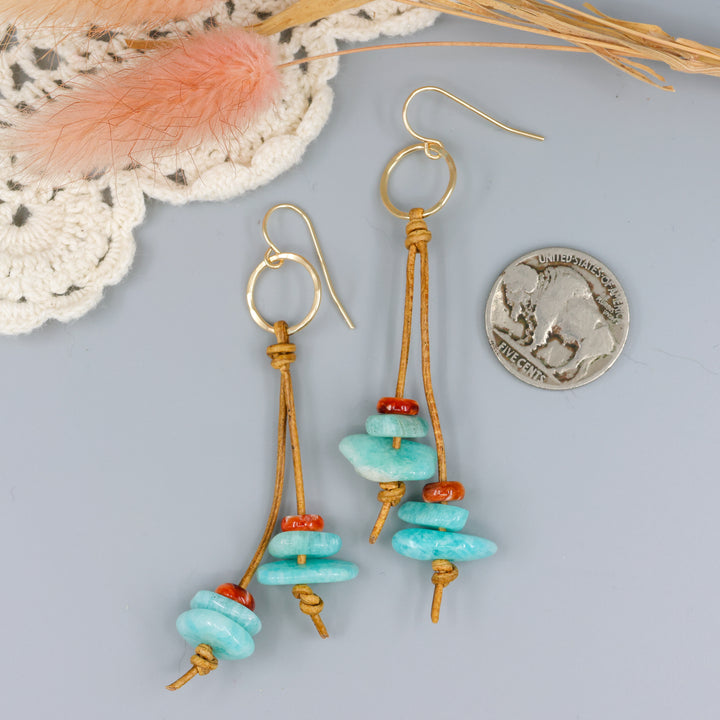 handmade gold fill and leather fringe earrings with amazonite and spiny oyster beads with a nickel for size comparison