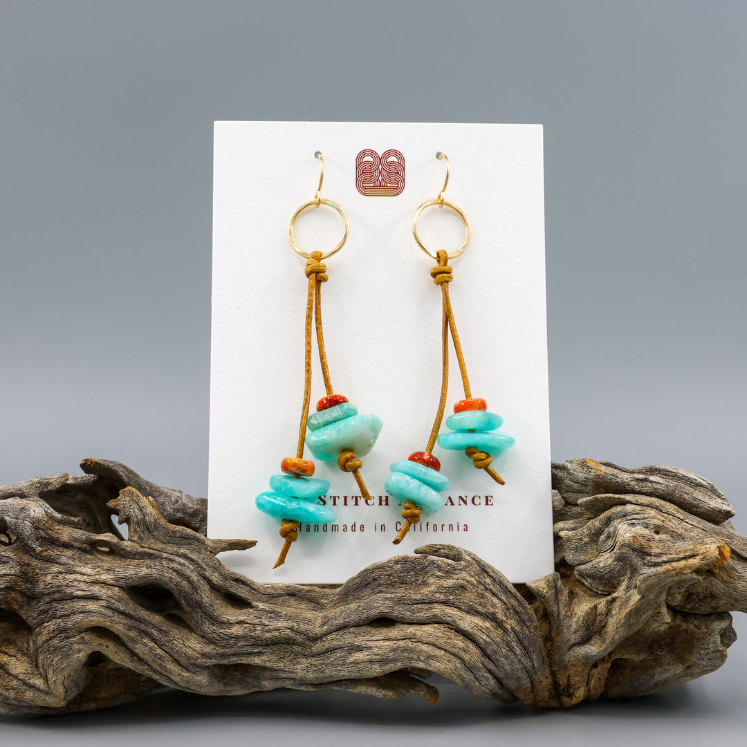 handmade gold fill and leather fringe earrings with amazonite and spiny oyster beads on a white card