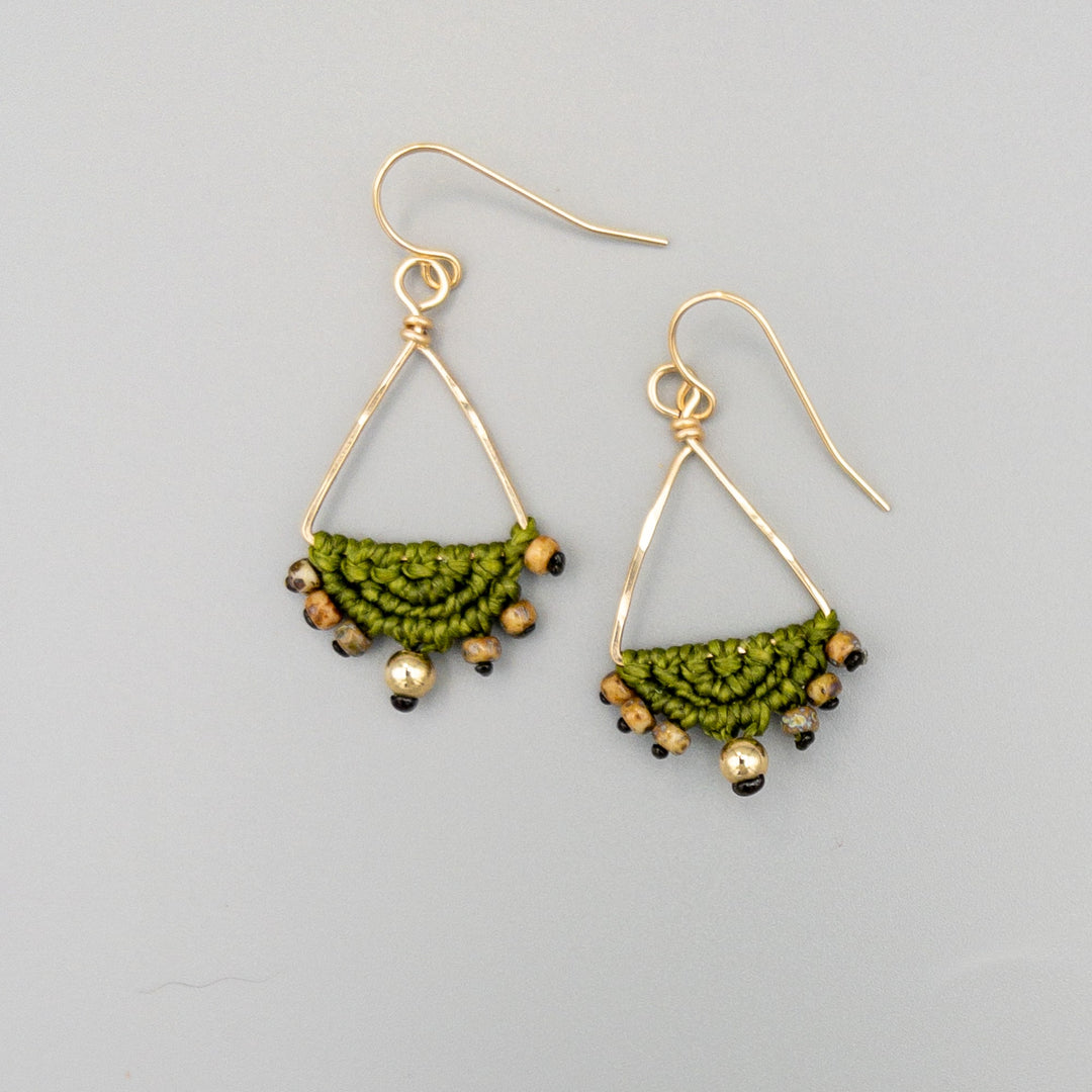 gold fill triangle hoop macrame earrings in olive green on a gray background