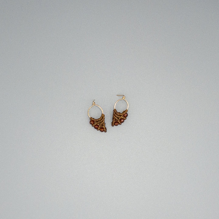gold fill and hessonite on a gray background
