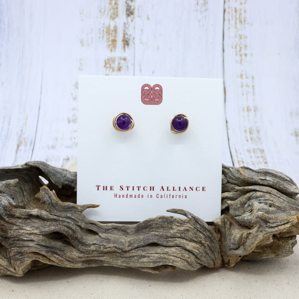 handmade amethyst and gold filled stud earrings on a white card