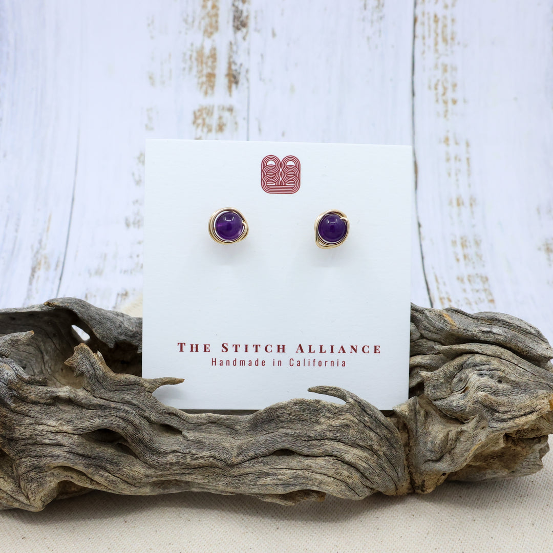 handmade amethyst and gold filled stud earrings on a white card