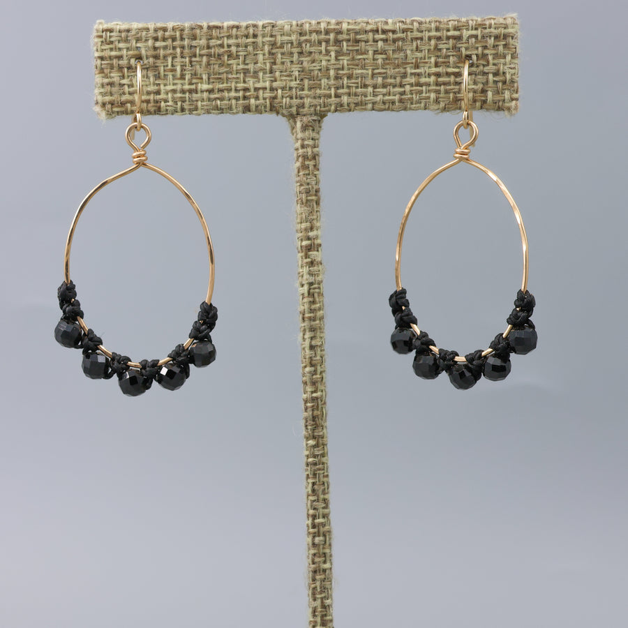 handmade gold hoops with black spinel beads and macrame