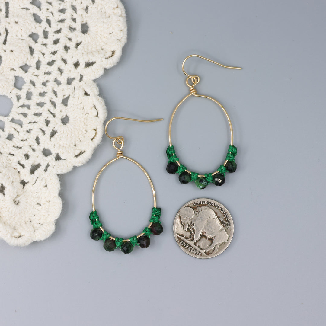 handmade gold hoop macrame earrings with ruby in zoisite beads with a nickel for size comparison