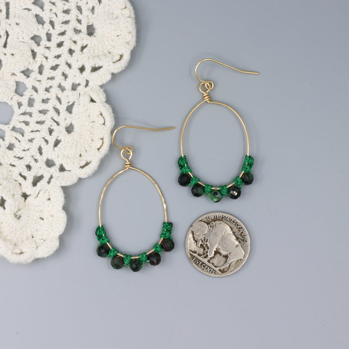 handmade gold hoop macrame earrings with ruby in zoisite beads with a nickel for size comparison
