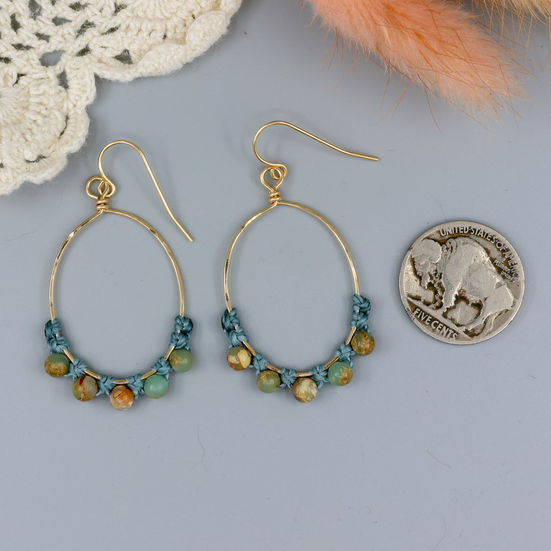 handmade gold hoop macrame earrings with aqua terra jasper beads with a nickel for size comparison