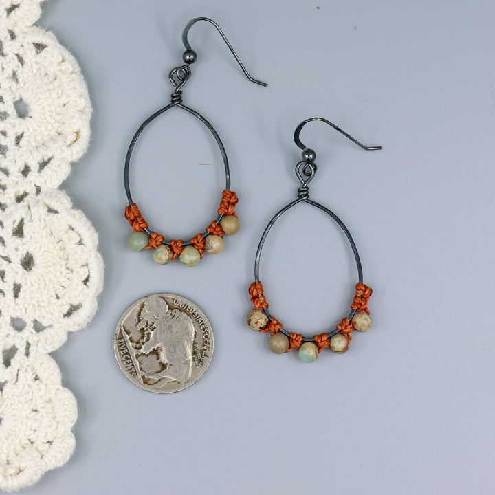 handmade aqua terra jasper beaded hoop earrings with a nickel for size comparison