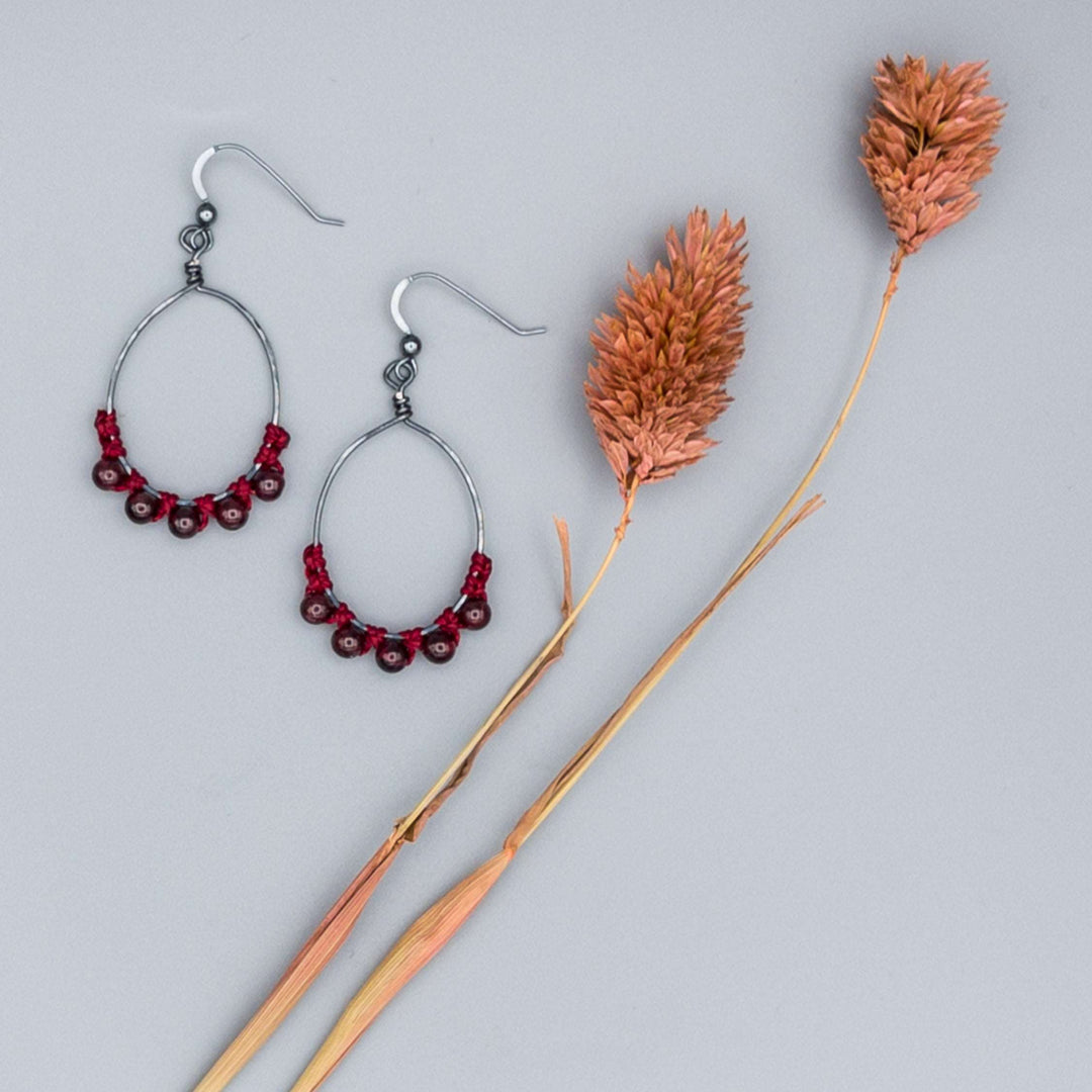 garnet bead oval hoop earrings in oxidized sterling silver