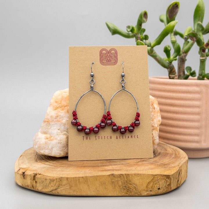garnet oval hoop earrings in oxidized sterling silver