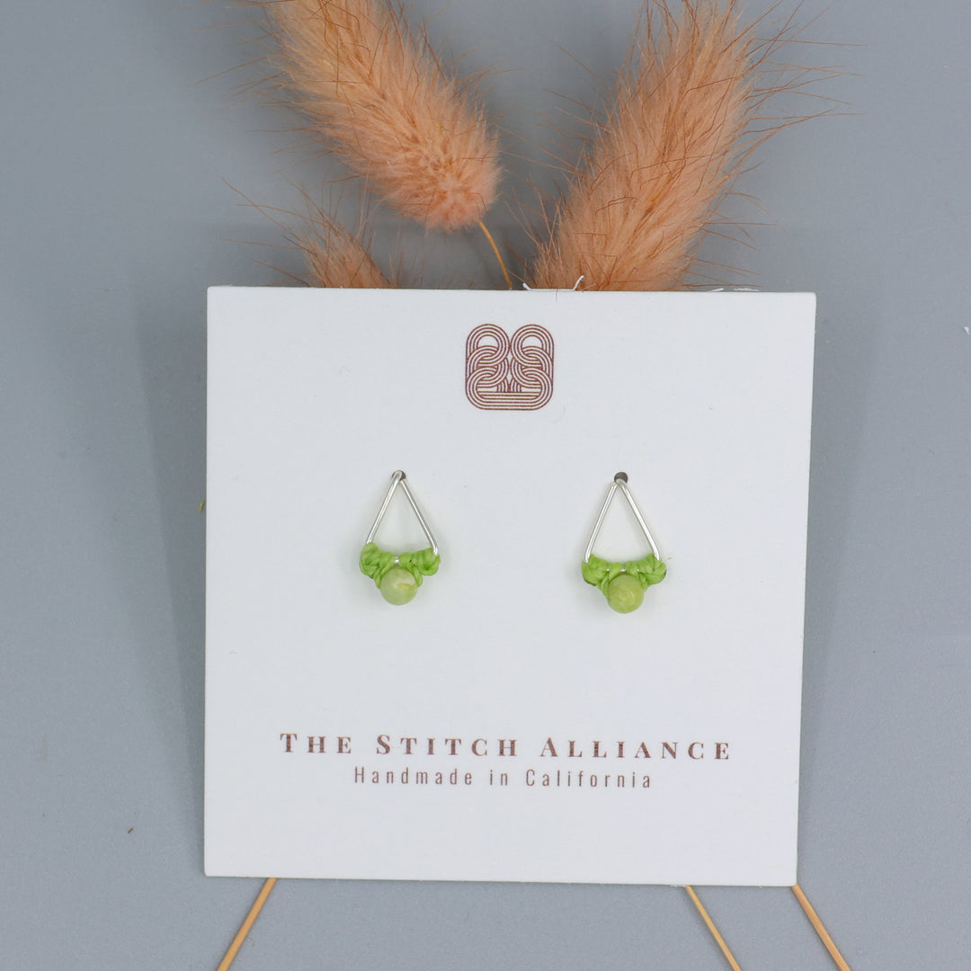 handmade peridot stud earrings sterling silver triangle on white card