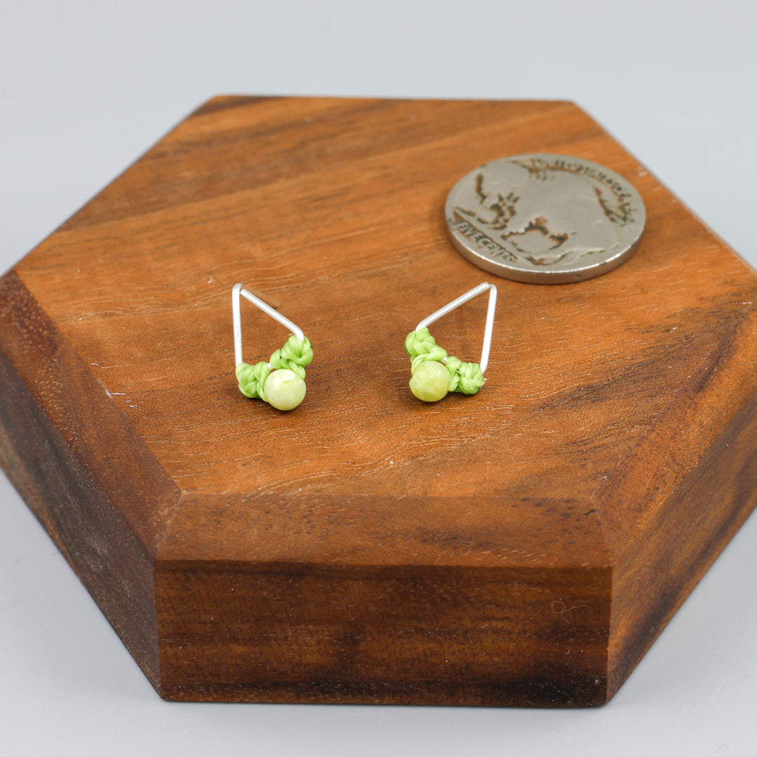 peridot stud earrings sterling silver triangle with coin for size comparison