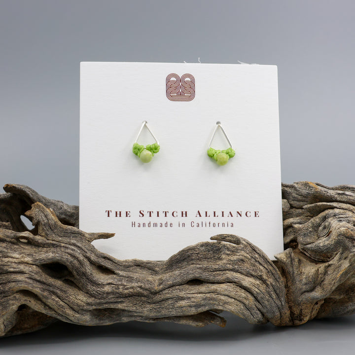peridot stud earrings sterling silver triangle on white card