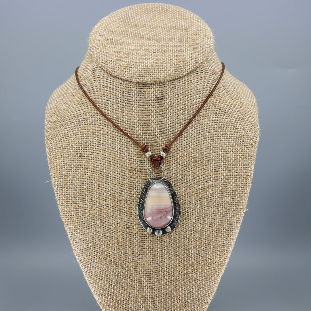 handmade pink and yellow jasper sterling silver necklace on leather cord on mannequin