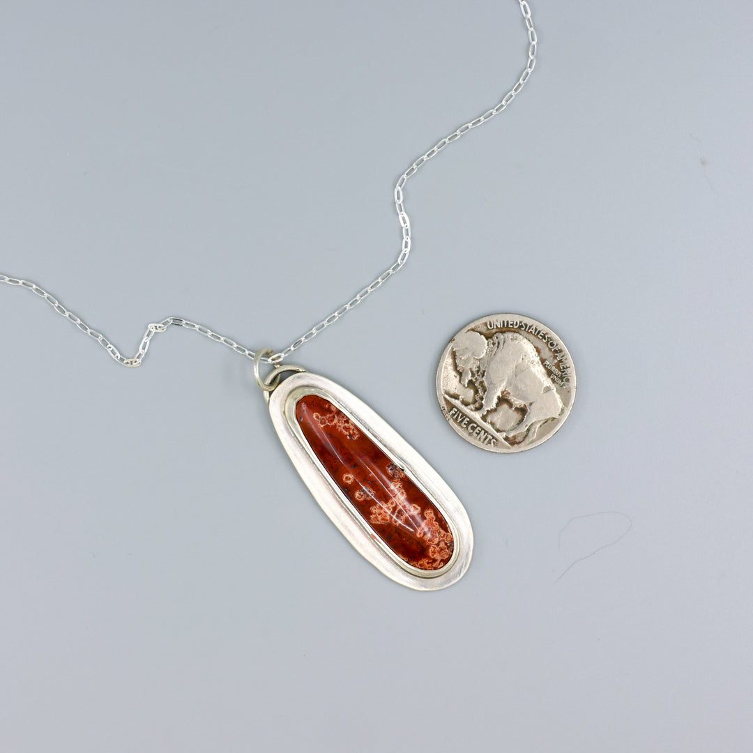 handmade red jasper sterling silver pendant on sterling silver chain with a nickel for size comparison