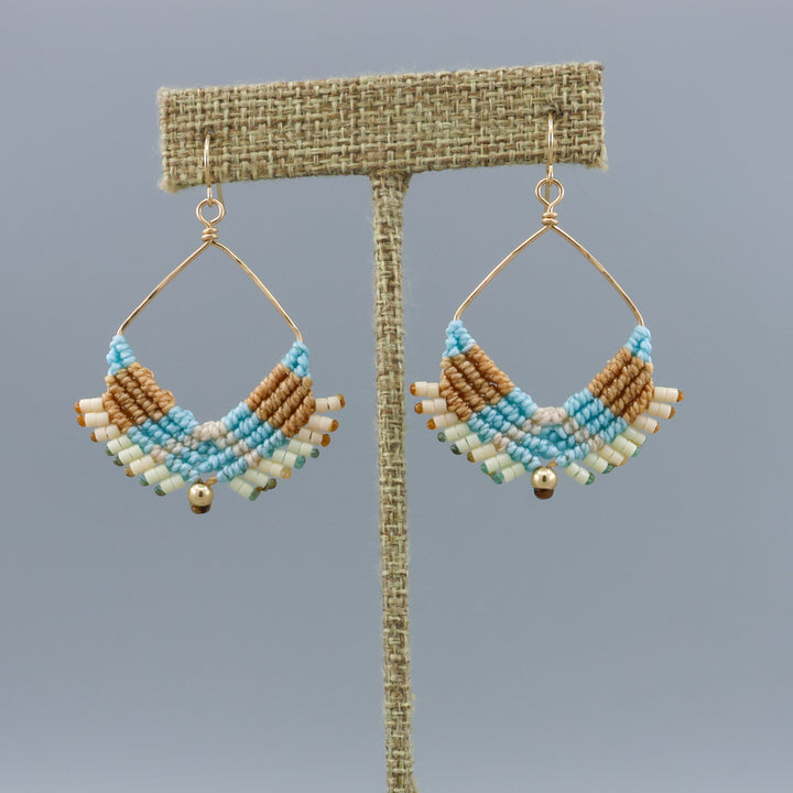 handmade square hoop macrame earrings gold fill and coastal colors on a linen hanger