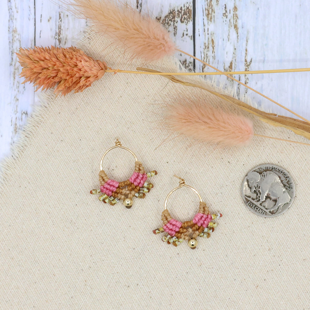 pink and gold macrame earrings with handmade gold filled wire posts shown with a coin for size comparison