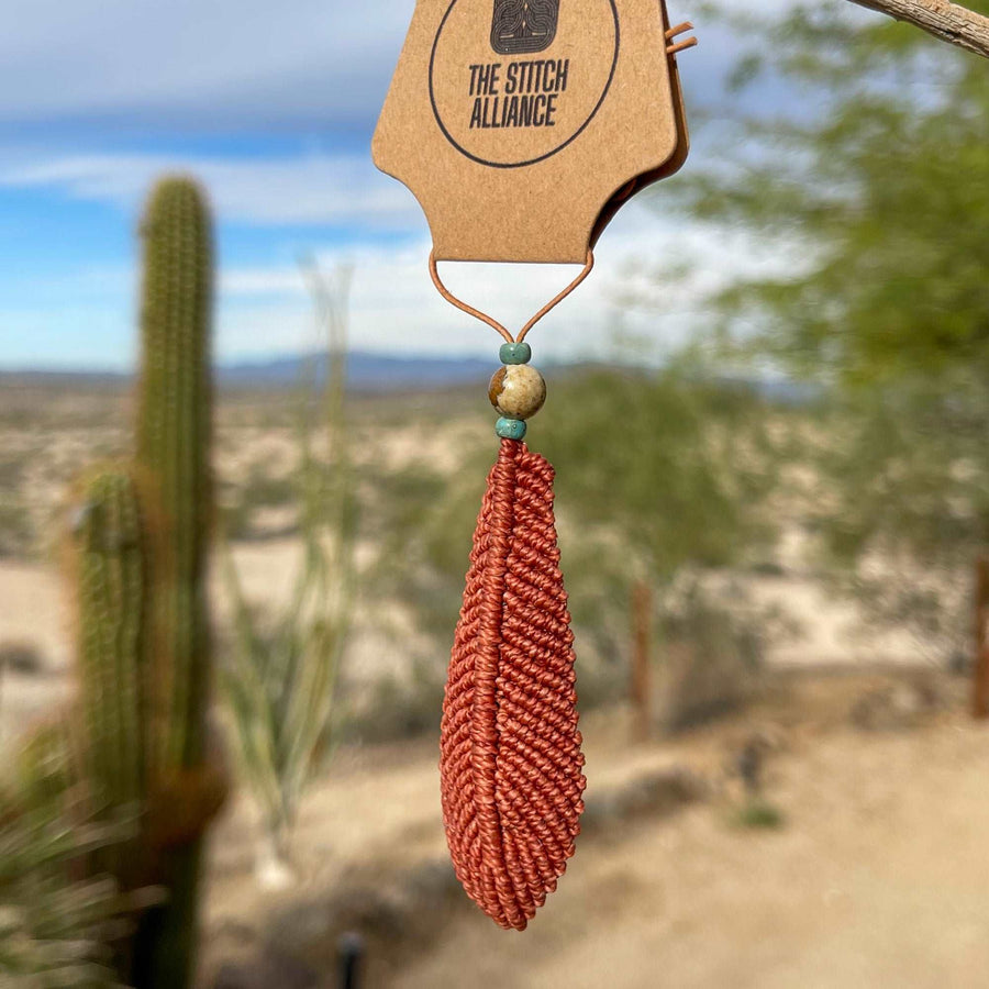 Large macrame feather with diffuser bead on leather cord