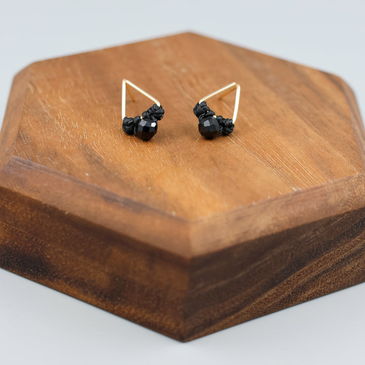 handmade triangle shaped earrings in gold fill with a black spinel bead detail view