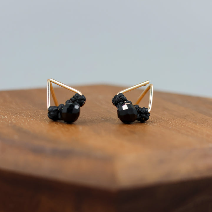 handmade triangle shaped earrings in gold fill with a black spinel bead