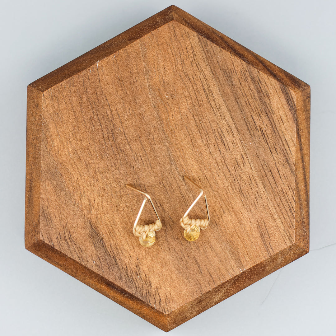 handmade gold fill  triangle stud earrings with a citrine bead overhead view