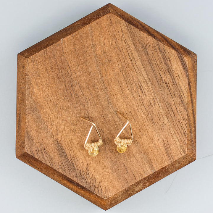 handmade gold fill  triangle stud earrings with a citrine bead overhead view