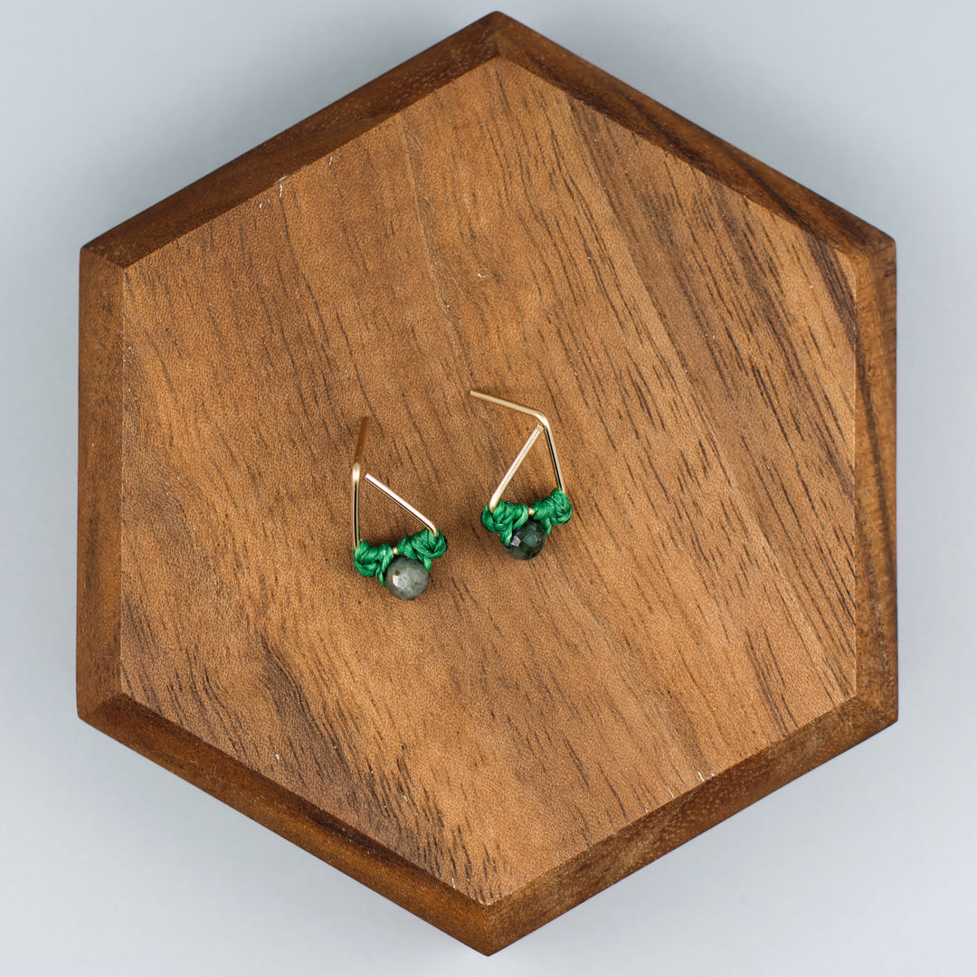 handmade gold fill  triangle stud earrings with emerald beads overhead view