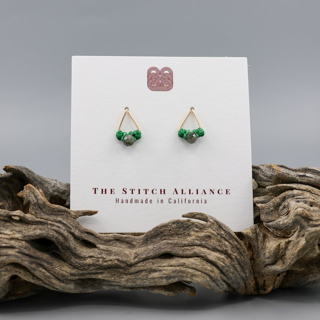 handmade gold fill  triangle stud earrings with emerald beads on a white card