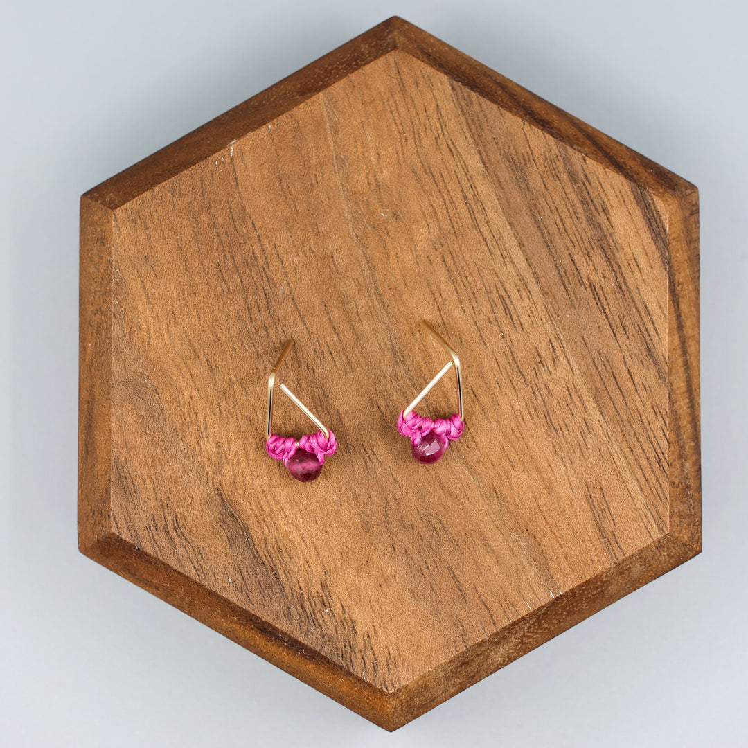 handmade gold filled triangle stud earrings with pink tourmaline beads overhead view